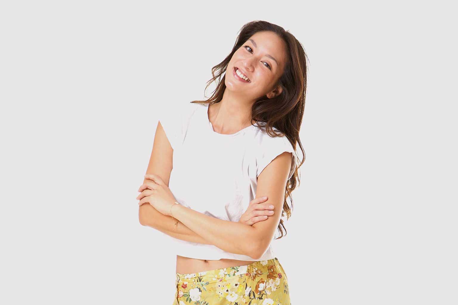 Smiling customer wearing an altered top and patterned skirt