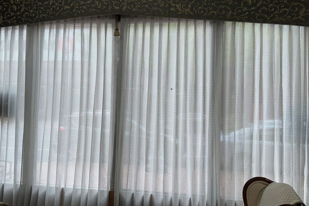 Custom sheer drapery panels hung and finished at a customer home