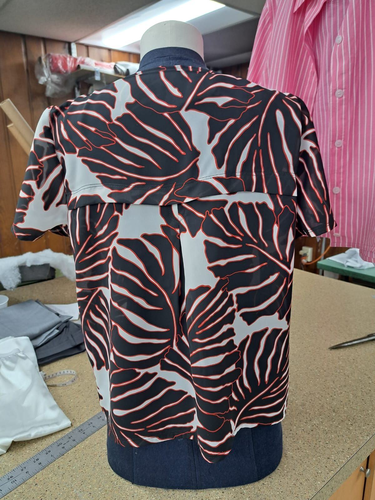 Patterned blouse reshaped and finished on a dress form in the workroom