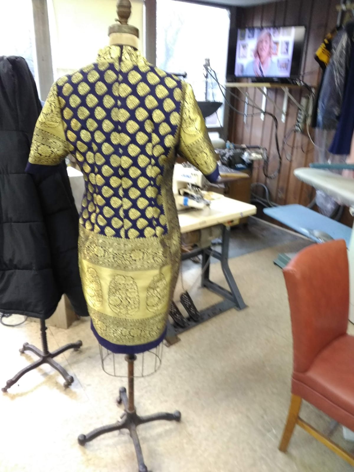 Custom garment pinned on a tailoring dress form mid-construction